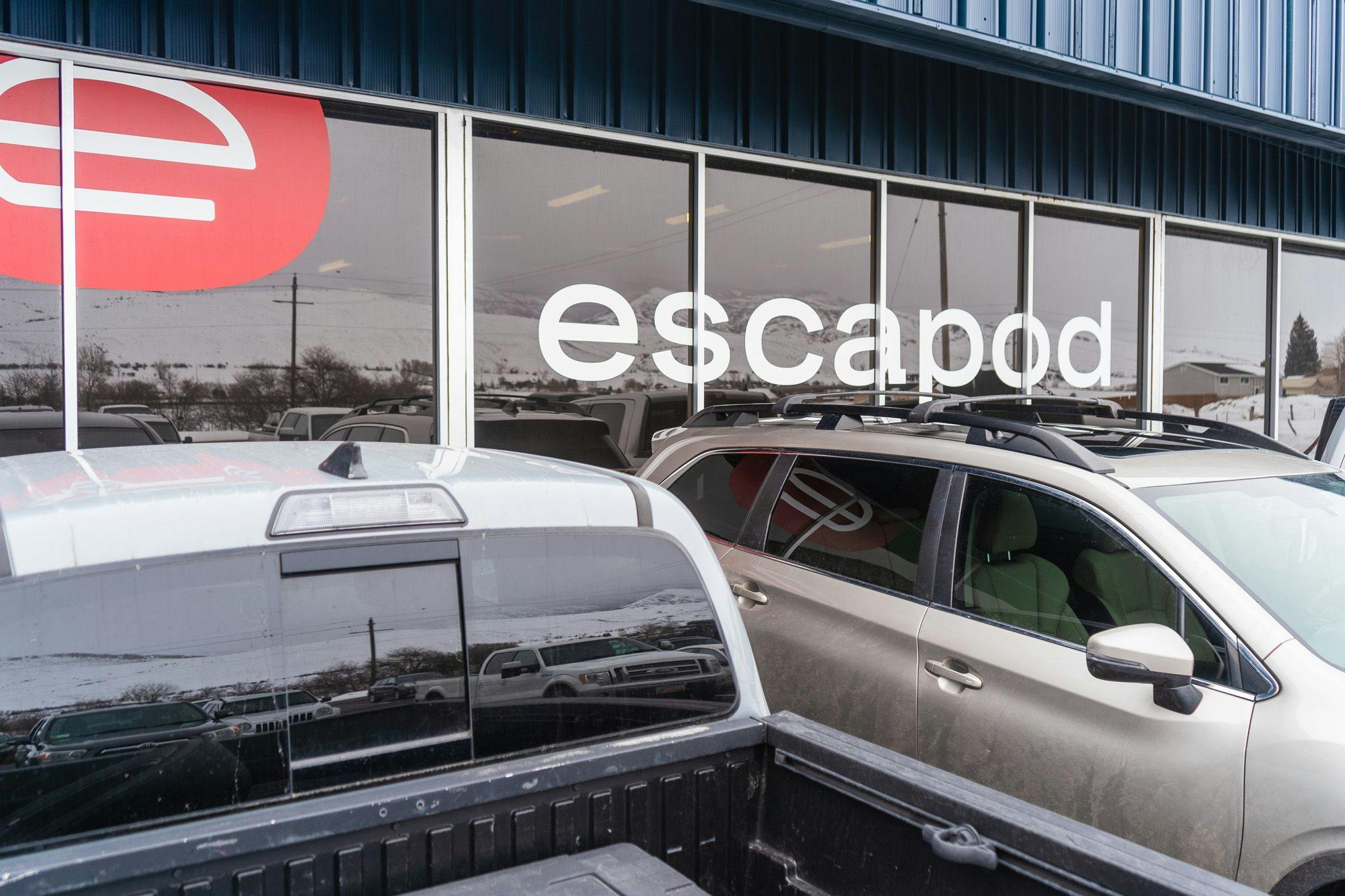 The Escapod Headquarters building with our classic E logo on the front, where we build of our offroad trailers.