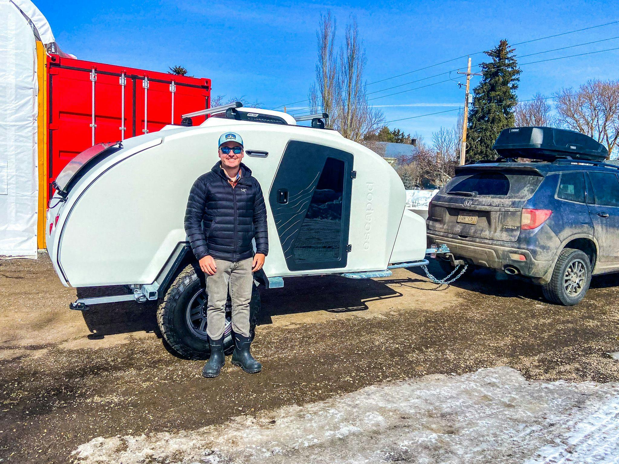 A Powder and Obsidian color combo TOPO2, a custom offroad trailer, being picked up by it's new owner.