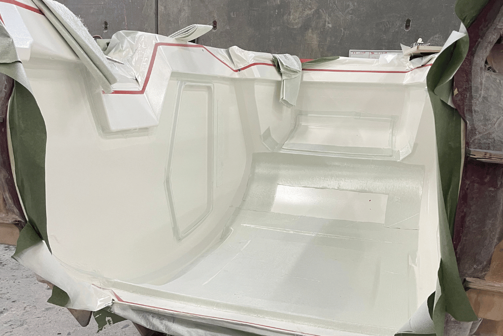 The infusion process of the TOPO2 on display as Fiberglass in infusion into the TOPO2 mold.