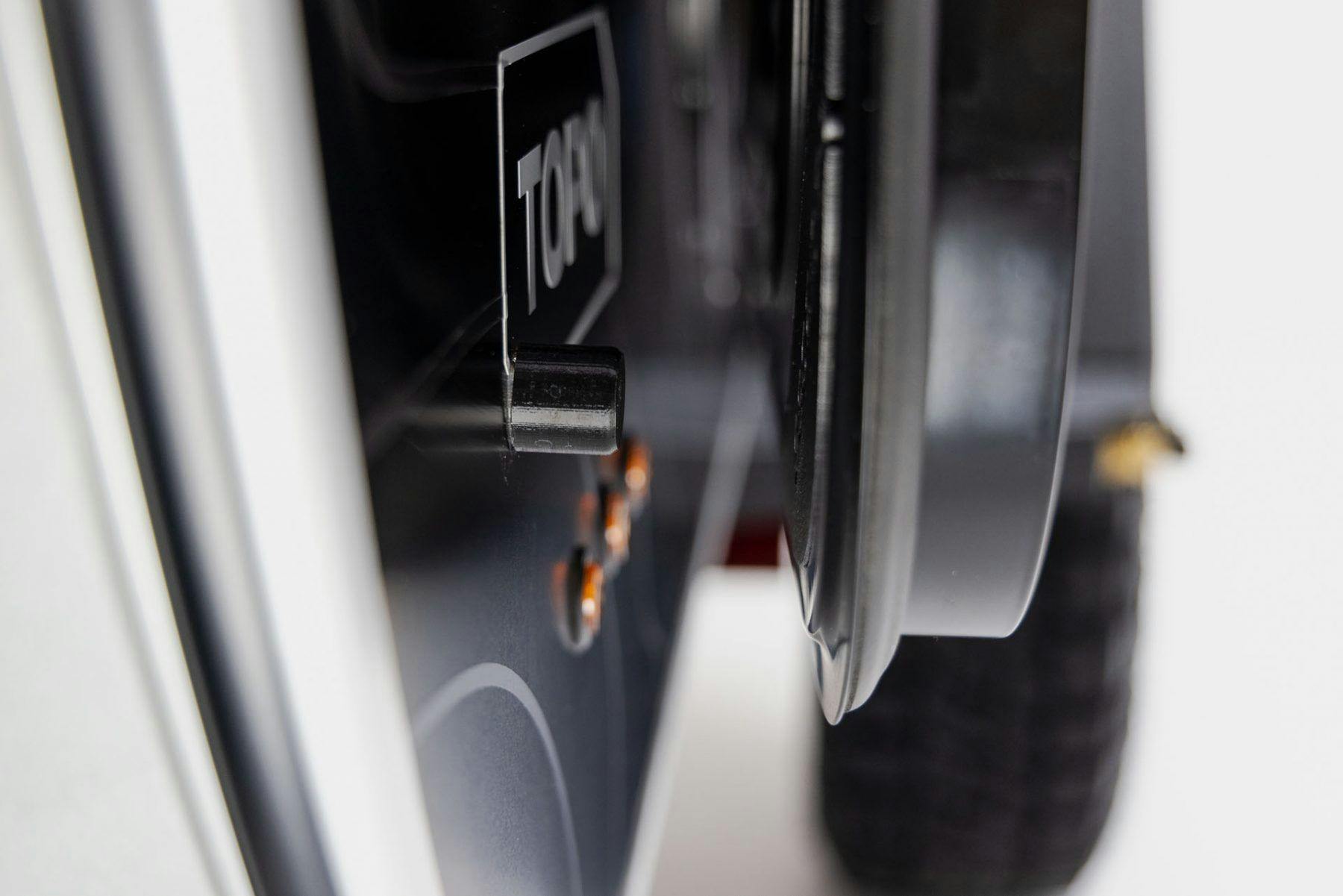 Details of a 3D printed magnetic door catch on a teardrop trailer.