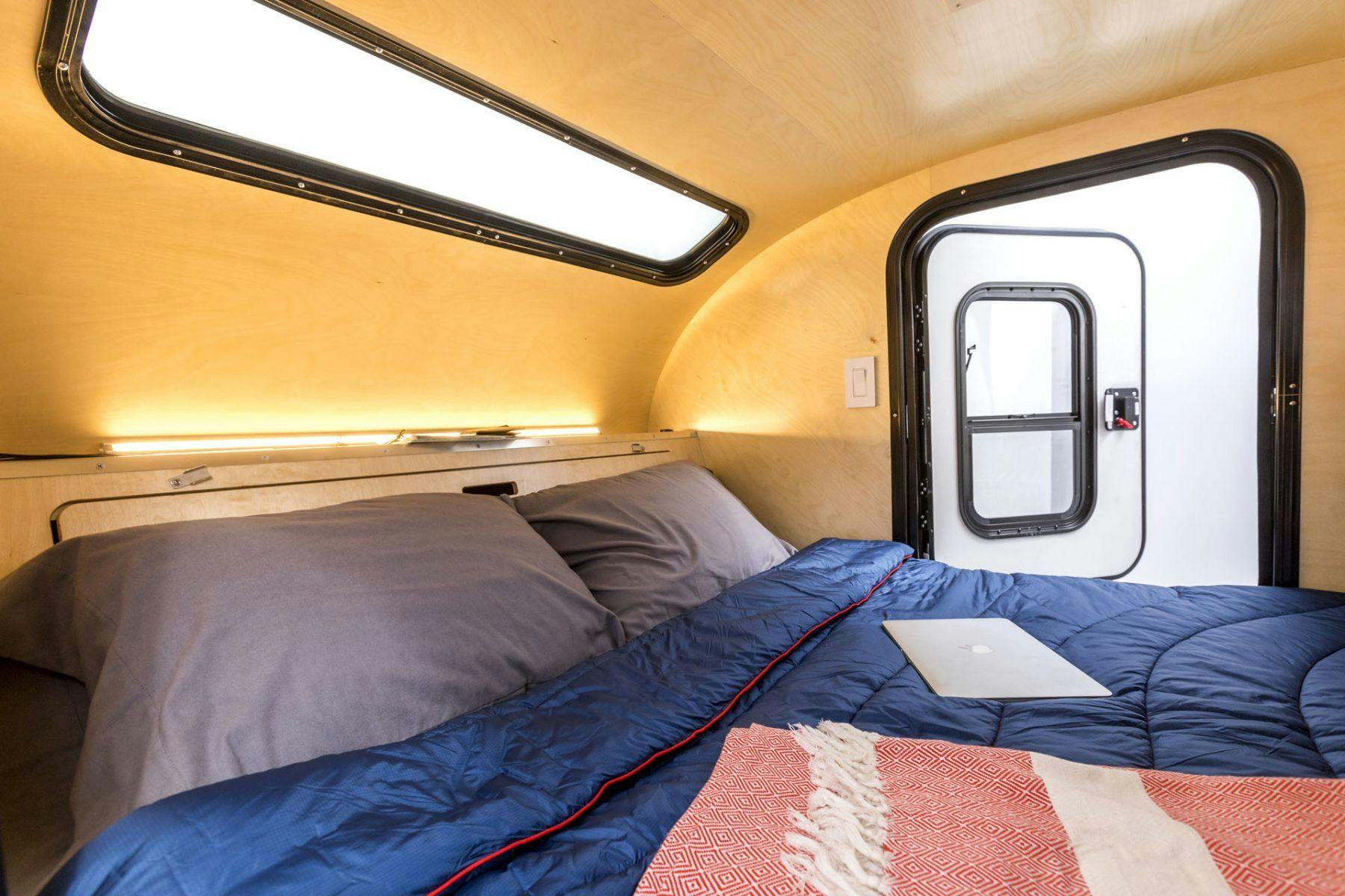 The interior of an adventure camper, showing the birch woodwork for the interior cabin. construction.