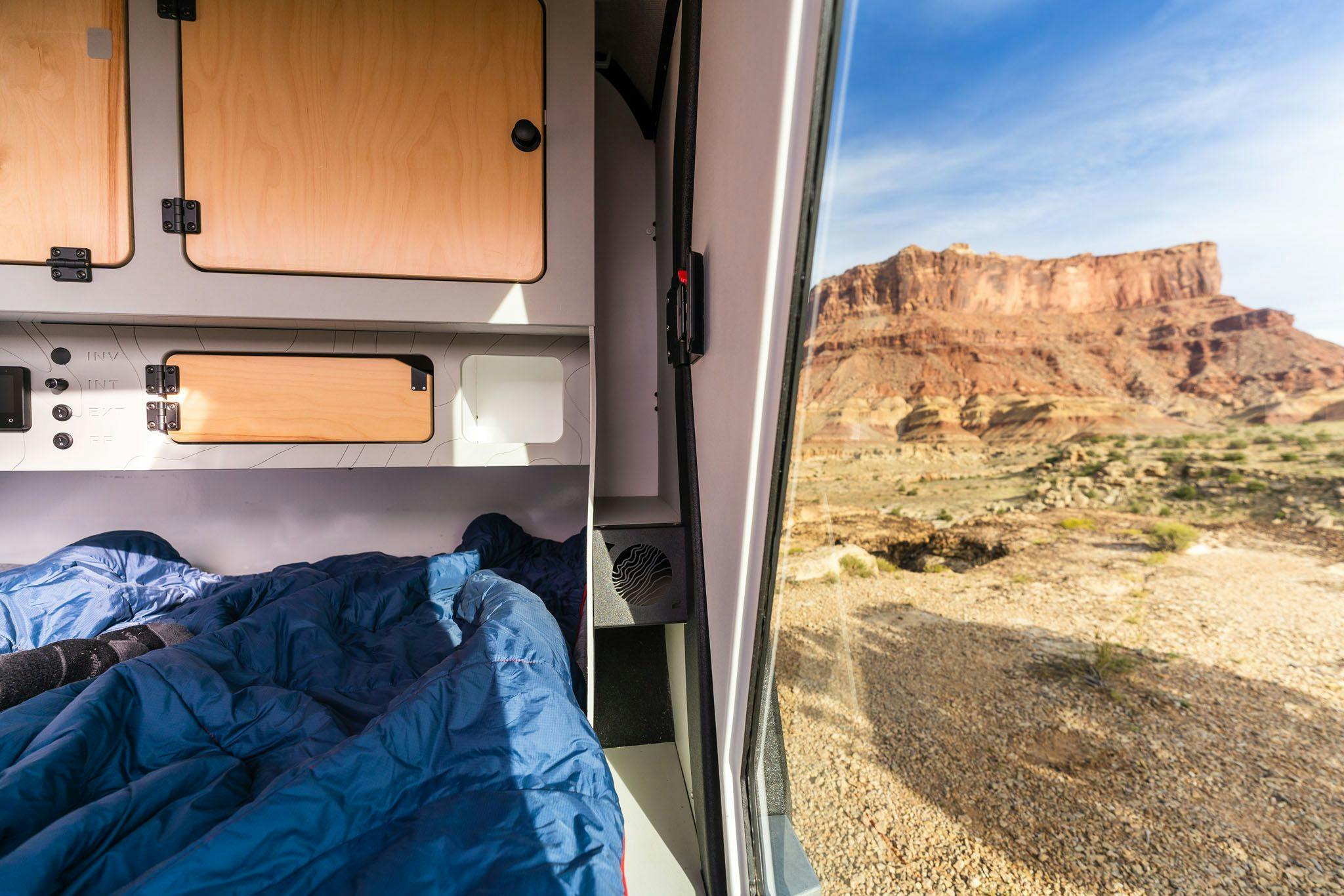 The interior of the TOPO2, a teardrop trailer, features a heated mudroom in the cabin.