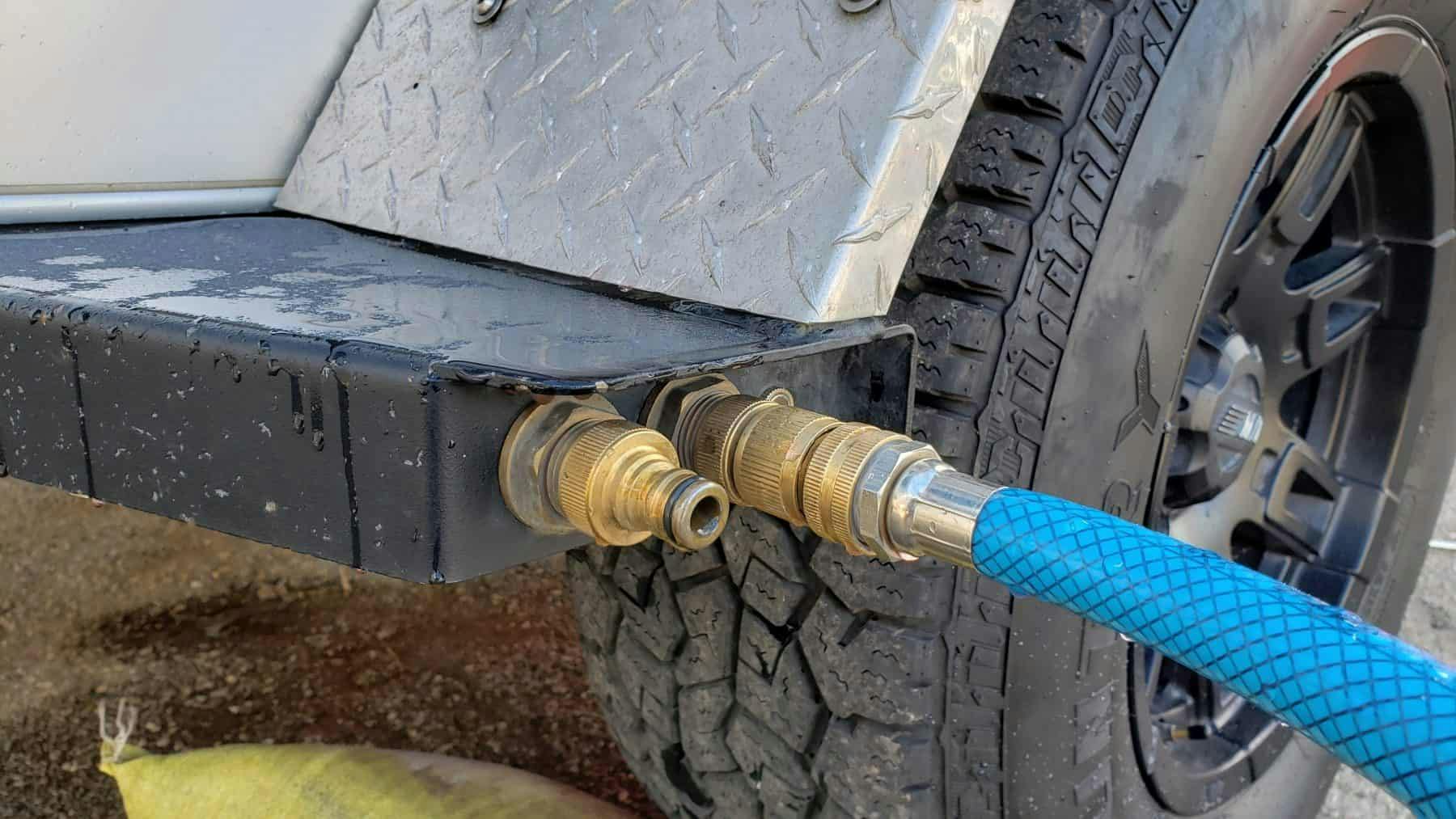 Water input with a hose attached on an Original TOPO, an offroad trailer.
