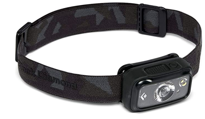 A Black Diamond headlamp that makes a great addition to a campsite.