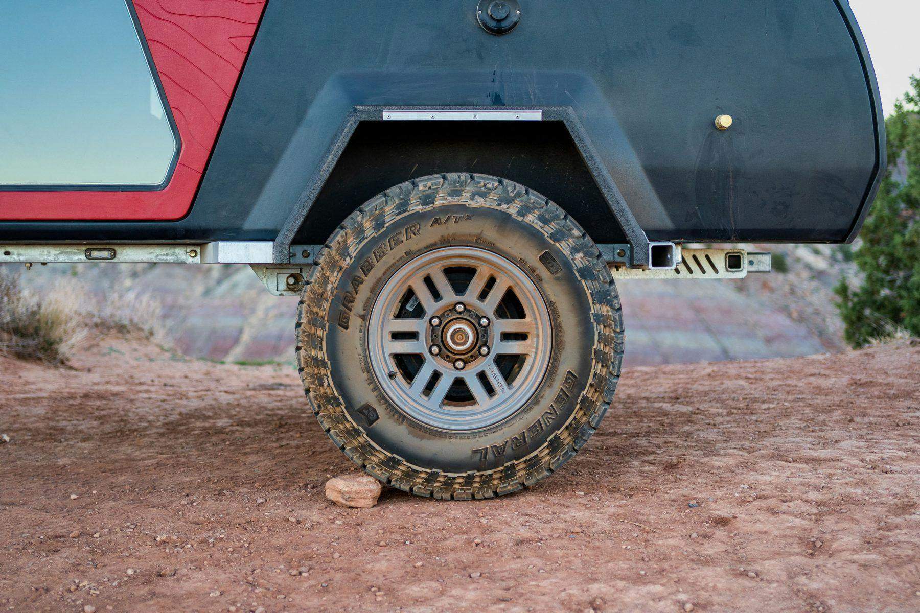 Offroad wheels and tires used on a TOPO2, a teardrop camper.