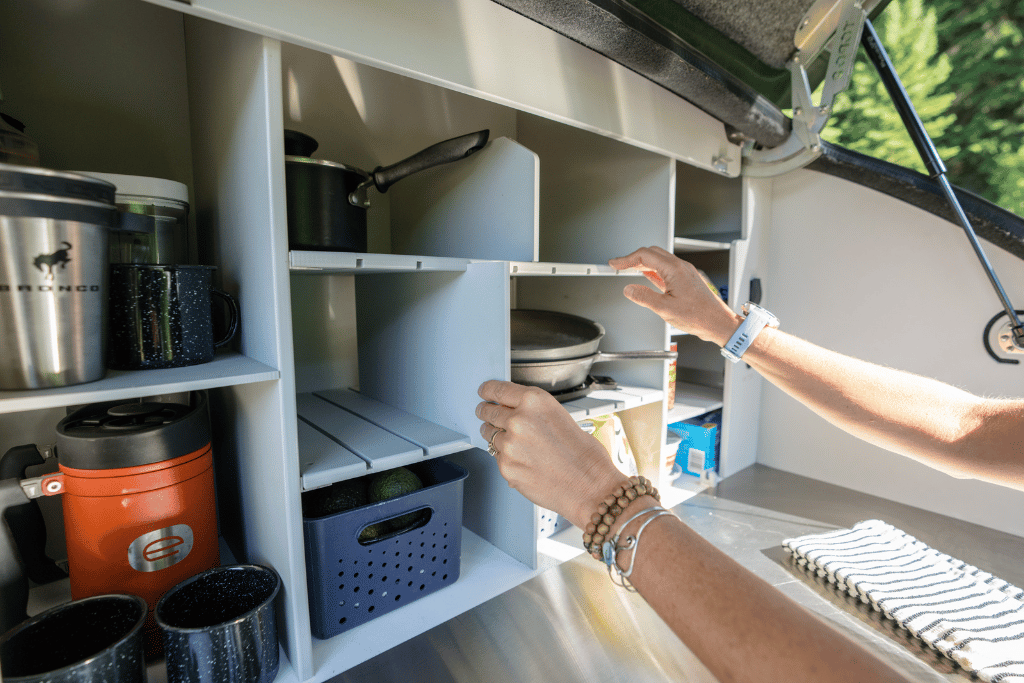 In the camp kitchen of the TOPO2, an offroad trailer, the shelving is modular allowing you to customize the space.
