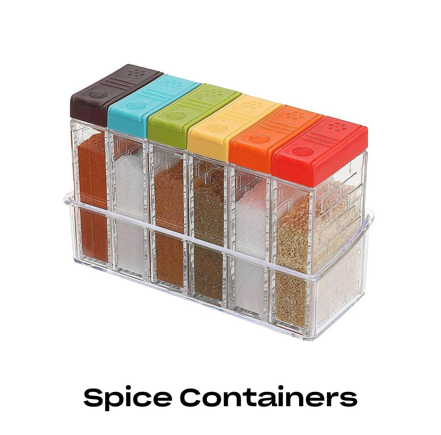 A stack of 6 spice containers with various colored lids.
