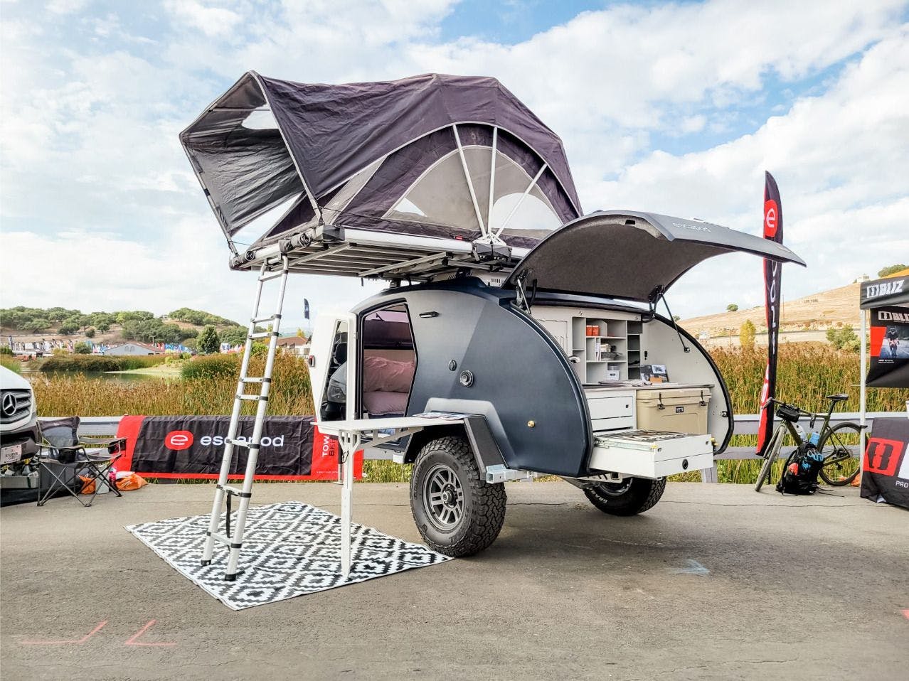 A teardrop trailer (TOPO2) on display at an Overlanding event in California.