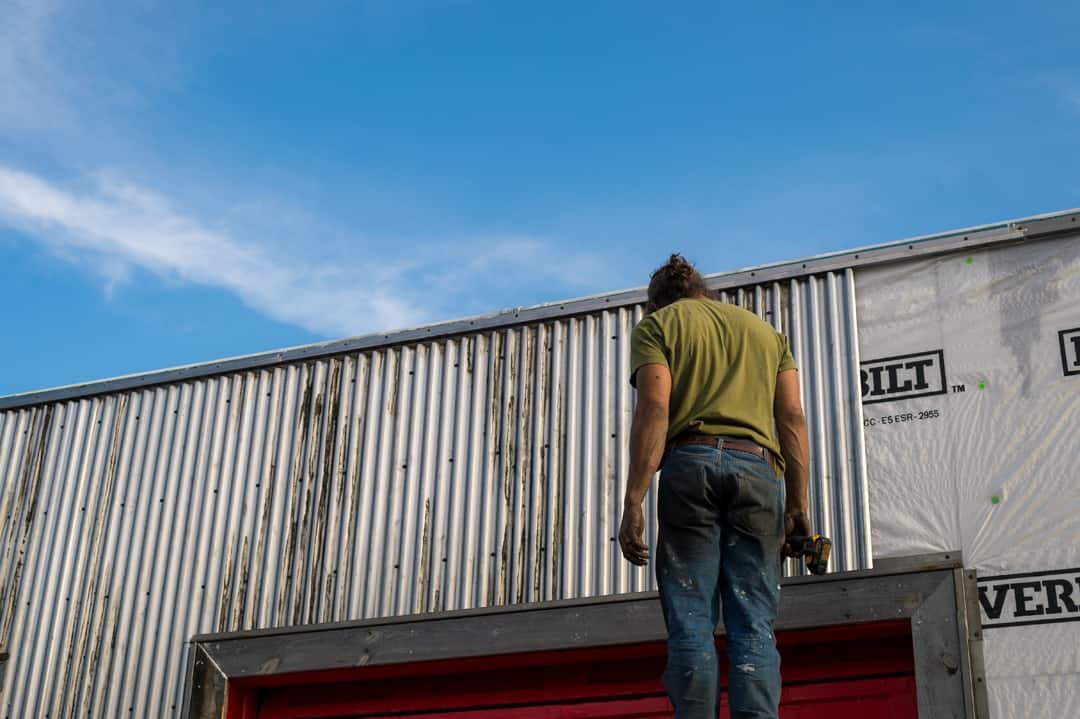 image of a man remodeling a Manufacturing shop.