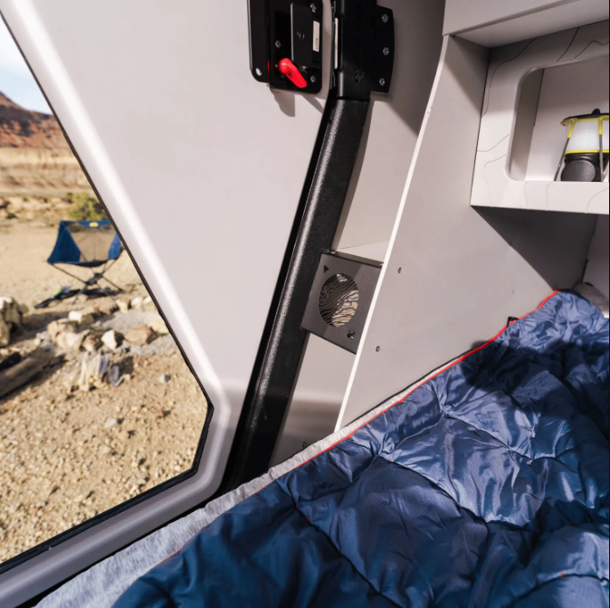 An image of the interior of a teardrop camping, displaying the heated mudroom in the TOPO2.
