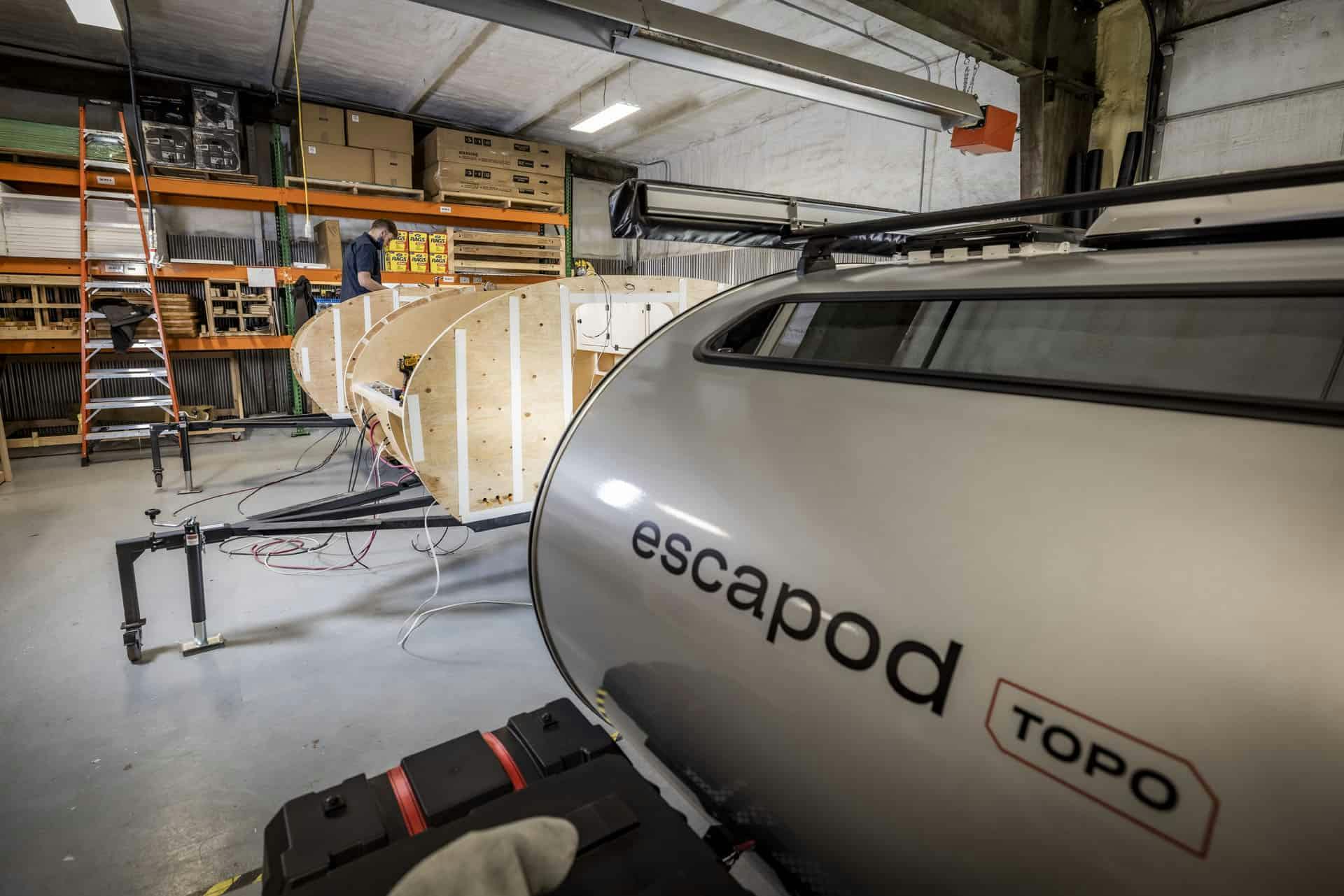 Teardrop camper being built in a small manufacturing facility.